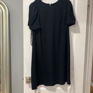 Black dress with embellishments on sleeves
